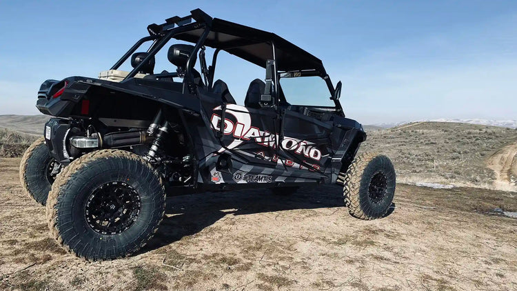 Diamond branded UTV on an off road trail.