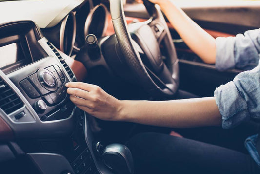 A driver turns up their music while on the road.